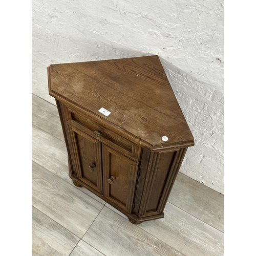 43 - An oak corner cabinet