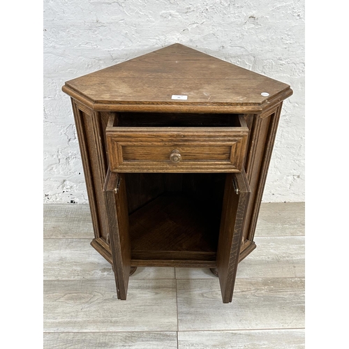 43 - An oak corner cabinet