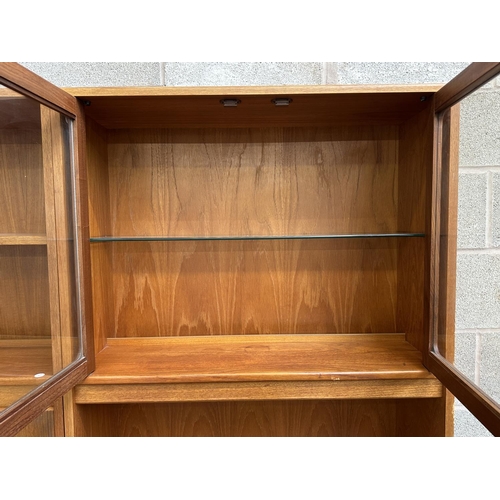 44 - A mid 20th century G Plan teak wall unit/display cabinet - approx. 199cm high x 162cm wide x 45cm de... 