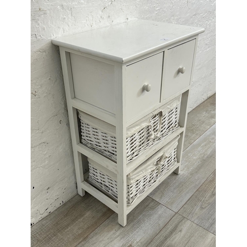 48 - A modern white painted cabinet with two wicker baskets - approx. 68cm high x 45cm wide x 30cm deep