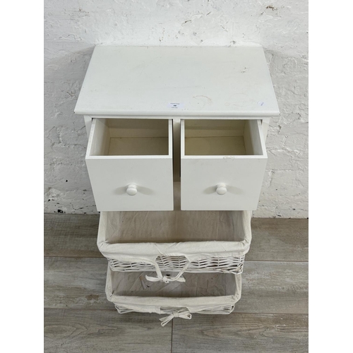 48 - A modern white painted cabinet with two wicker baskets - approx. 68cm high x 45cm wide x 30cm deep