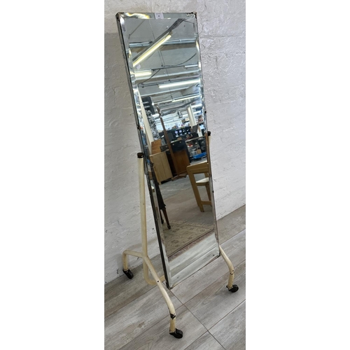 49 - A mid 20th century white painted tubular metal bevelled cheval mirror on castors - approx. 140cm hig... 