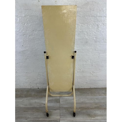 49 - A mid 20th century white painted tubular metal bevelled cheval mirror on castors - approx. 140cm hig... 