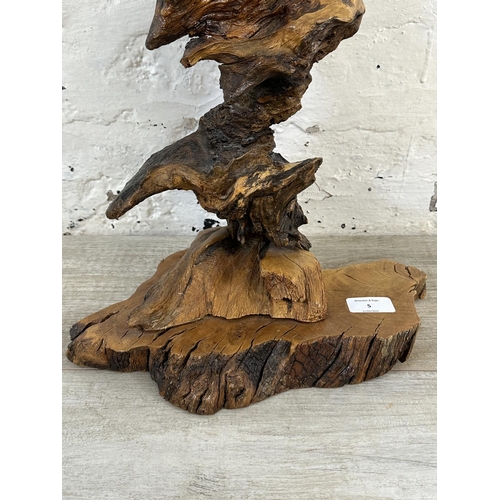 5 - A late 20th century reclaimed wood abstract sculpture on stand, signed to base and dated 1993 - appr... 