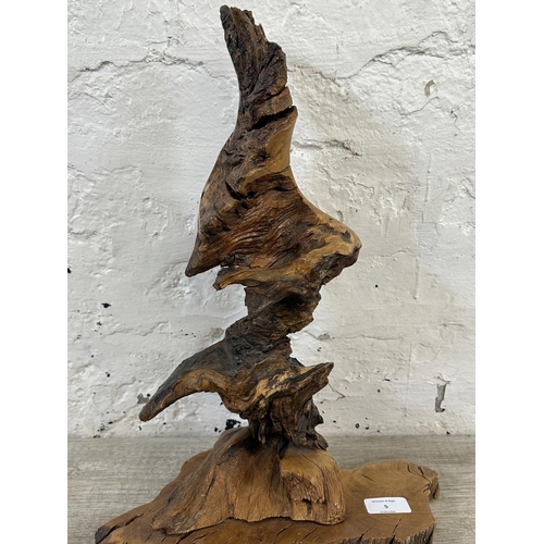 5 - A late 20th century reclaimed wood abstract sculpture on stand, signed to base and dated 1993 - appr... 