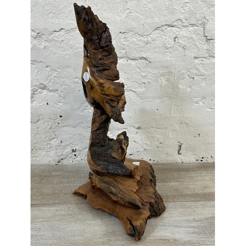 5 - A late 20th century reclaimed wood abstract sculpture on stand, signed to base and dated 1993 - appr... 