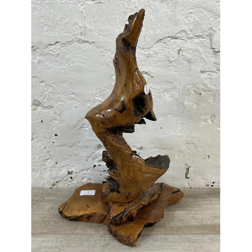 5 - A late 20th century reclaimed wood abstract sculpture on stand, signed to base and dated 1993 - appr... 