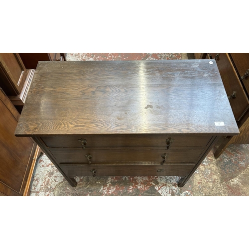 50 - An early 20th century oak chest of drawers - approx. 82cm high x 91cm wide x 45cm deep