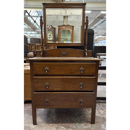 51 - An early 20th century oak dressing chest - approx. 153cm high x 84cm wide x 45cm deep