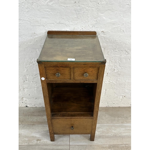 54 - A 1930s oak bedside cabinet - approx. 79cm high x 36cm wide x 35cm deep