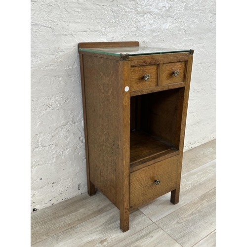 54 - A 1930s oak bedside cabinet - approx. 79cm high x 36cm wide x 35cm deep