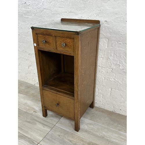 54 - A 1930s oak bedside cabinet - approx. 79cm high x 36cm wide x 35cm deep