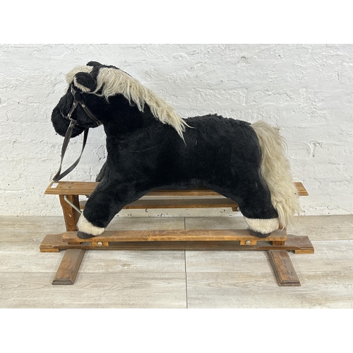 59 - A modern plush rocking horse on beech stand - approx. 80cm high x 47cm wide x 118cm deep