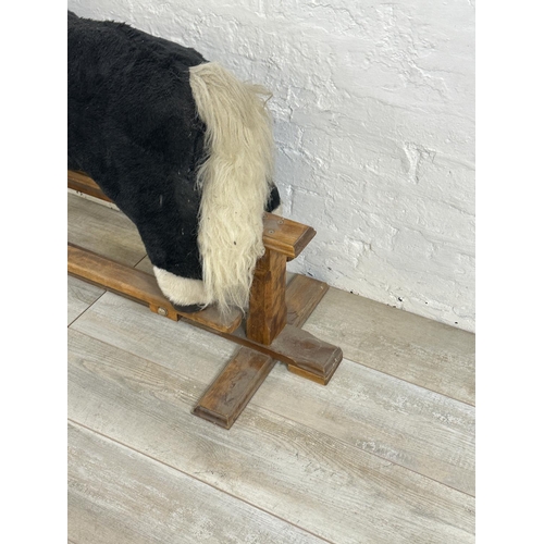 59 - A modern plush rocking horse on beech stand - approx. 80cm high x 47cm wide x 118cm deep