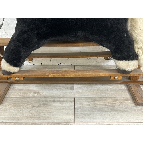 59 - A modern plush rocking horse on beech stand - approx. 80cm high x 47cm wide x 118cm deep