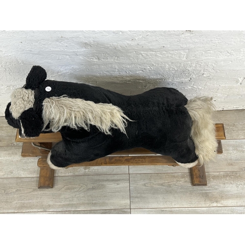 59 - A modern plush rocking horse on beech stand - approx. 80cm high x 47cm wide x 118cm deep