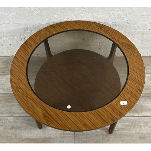 6 - A mid 20th century laminated teak and smoked glass circular two tier coffee table - approx. 46cm hig... 