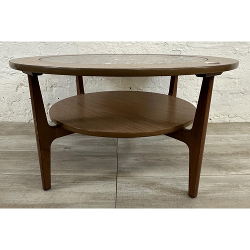 6 - A mid 20th century laminated teak and smoked glass circular two tier coffee table - approx. 46cm hig... 