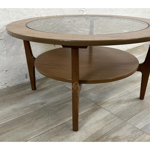 6 - A mid 20th century laminated teak and smoked glass circular two tier coffee table - approx. 46cm hig... 