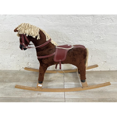 60 - A Davies of Liverpool brown plush rocking horse on beech stand - approx. 63cm high x 30cm wide x 92c... 