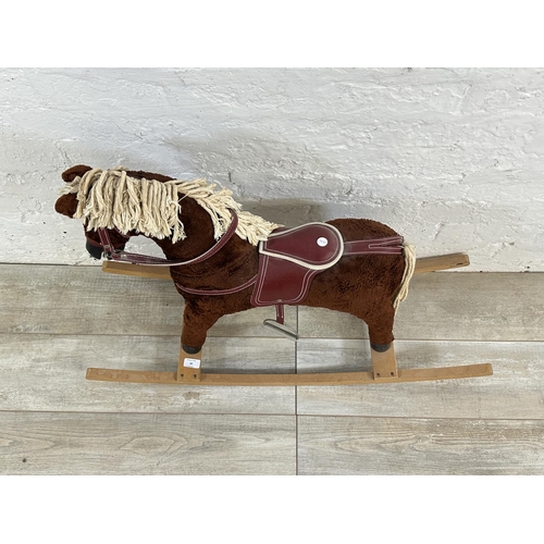 60 - A Davies of Liverpool brown plush rocking horse on beech stand - approx. 63cm high x 30cm wide x 92c... 