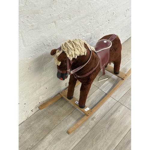 60 - A Davies of Liverpool brown plush rocking horse on beech stand - approx. 63cm high x 30cm wide x 92c... 