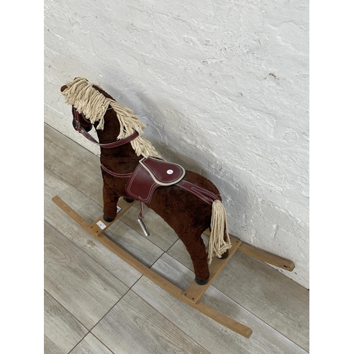 60 - A Davies of Liverpool brown plush rocking horse on beech stand - approx. 63cm high x 30cm wide x 92c... 