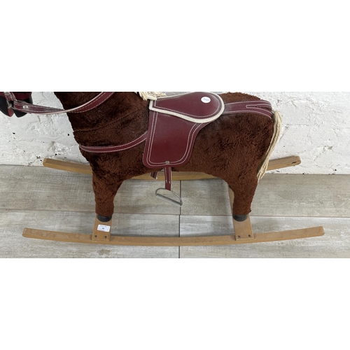 60 - A Davies of Liverpool brown plush rocking horse on beech stand - approx. 63cm high x 30cm wide x 92c... 