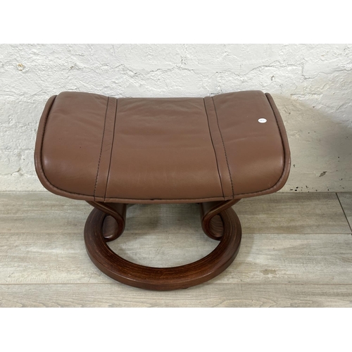 66 - An Ekornes Stressless brown leather and bentwood swivel reclining armchair and footstool