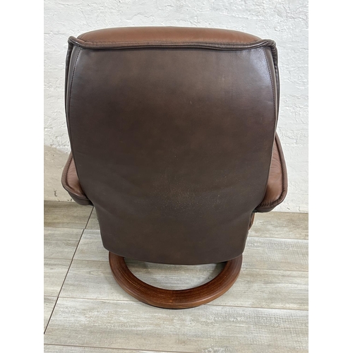 66 - An Ekornes Stressless brown leather and bentwood swivel reclining armchair and footstool