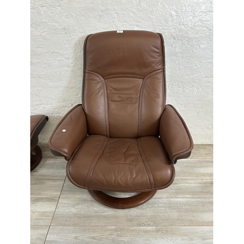 67 - An Ekornes Stressless brown leather and bentwood swivel reclining armchair and footstool