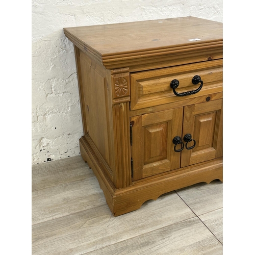 72 - A pine bedside cabinet - approx. 60cm high x 60cm wide x 48cm deep