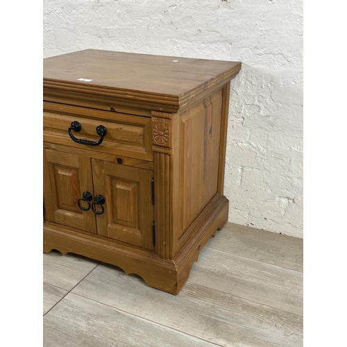 72 - A pine bedside cabinet - approx. 60cm high x 60cm wide x 48cm deep