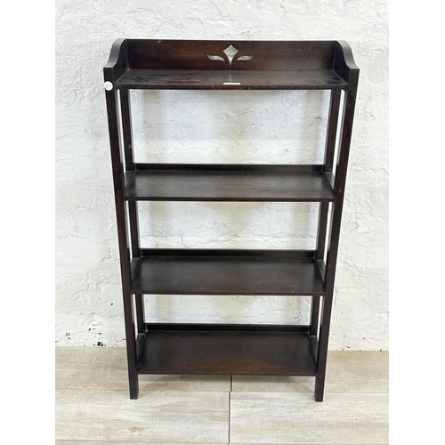 74 - An early 20th century carved oak three tier bookshelf - approx. 99cm high x 56cm wide x 19cm deep