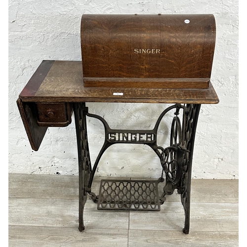 86 - A Singer cast iron and oak treadle sewing machine with case - serial no. Y7622957