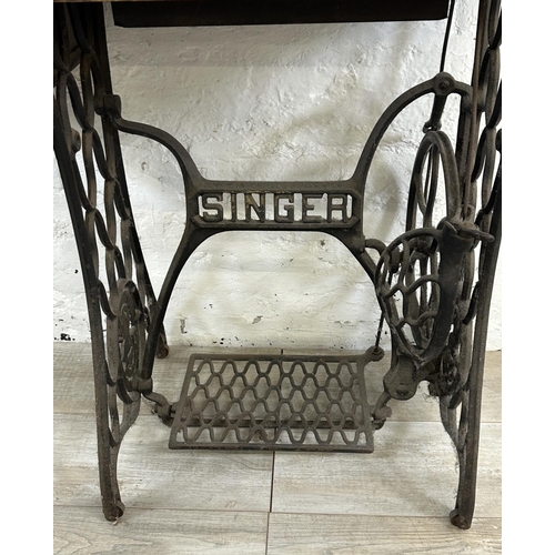 86 - A Singer cast iron and oak treadle sewing machine with case - serial no. Y7622957