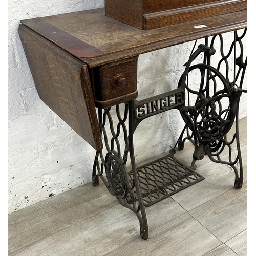 86 - A Singer cast iron and oak treadle sewing machine with case - serial no. Y7622957