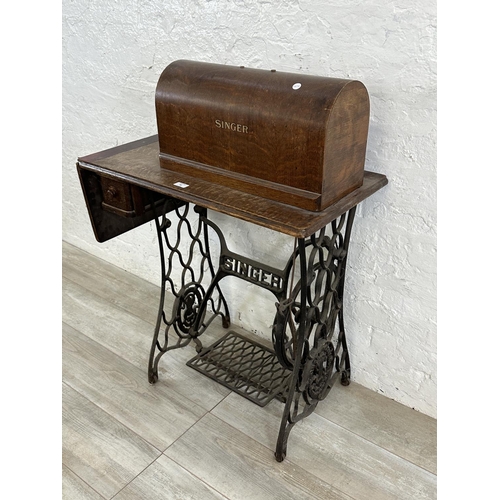 86 - A Singer cast iron and oak treadle sewing machine with case - serial no. Y7622957