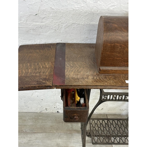 86 - A Singer cast iron and oak treadle sewing machine with case - serial no. Y7622957