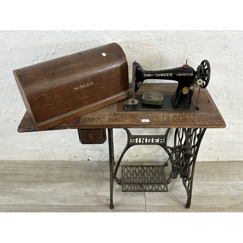 86 - A Singer cast iron and oak treadle sewing machine with case - serial no. Y7622957