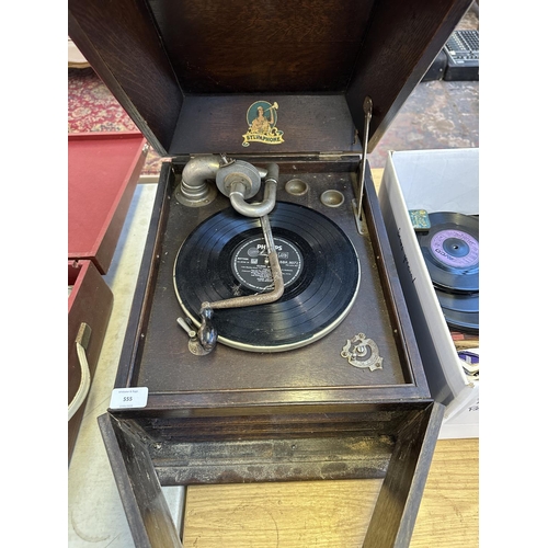 555 - A vintage Sylvaphone gramophone with winding handle and a collection of shellac and vinyl records