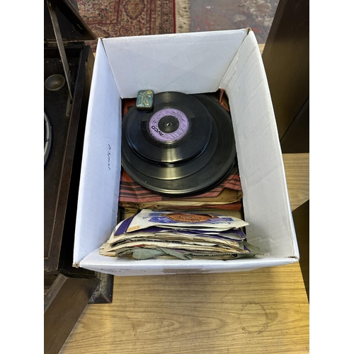 555 - A vintage Sylvaphone gramophone with winding handle and a collection of shellac and vinyl records