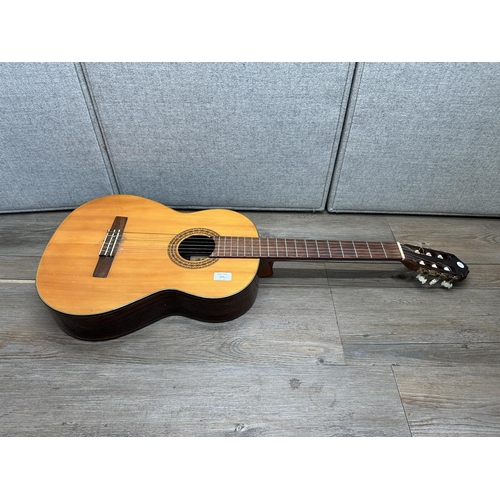 571 - A Kimbara full size nylon strung classical guitar