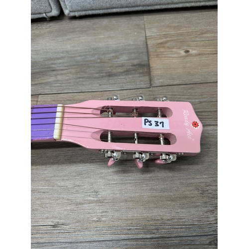 572 - A Ready Ace pink and purple child's steel strung acoustic guitar