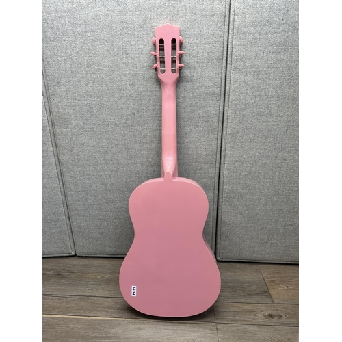 572 - A Ready Ace pink and purple child's steel strung acoustic guitar