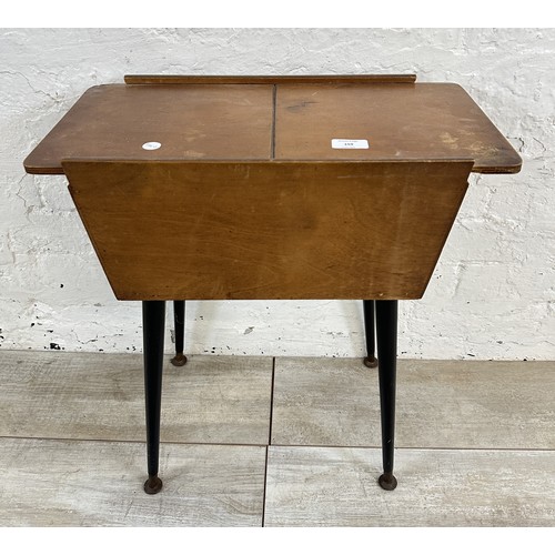 159 - A mid 20th century beech and plywood sewing box on atomic supports - approx. 57cm high x 50cm wide x... 