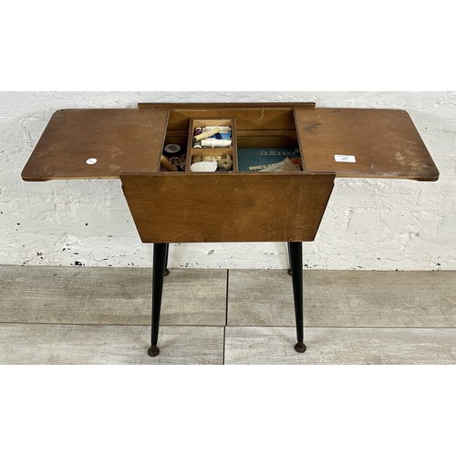 159 - A mid 20th century beech and plywood sewing box on atomic supports - approx. 57cm high x 50cm wide x... 