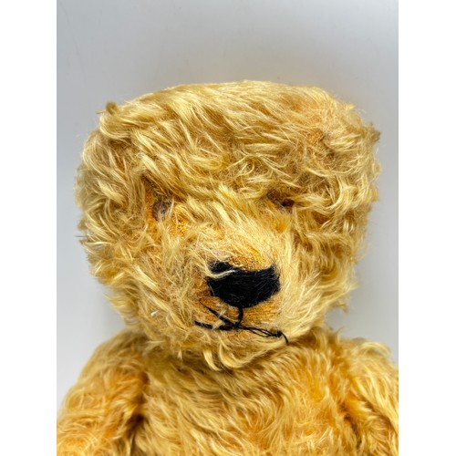 332A - A vintage blonde mohair articulated teddy bear - approx. 38cm high