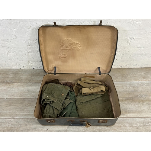 457 - A collection of military clothing to include Army & Navy Hat & Cap Co Ltd cap with broad arrow mark ... 