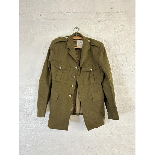 457 - A collection of military clothing to include Army & Navy Hat & Cap Co Ltd cap with broad arrow mark ... 